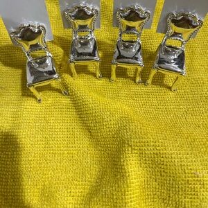 Set of 4 miniature silver plated chair place card holder.